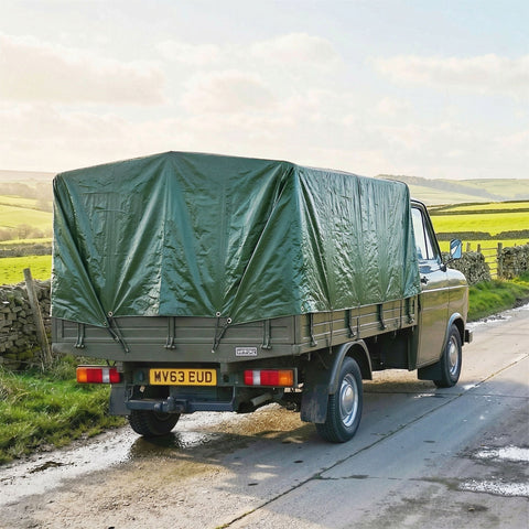 Olive green canvas waterproof tarpaulin with reinforced grommets covering a vintage utility truck ideal for diy greenhouses