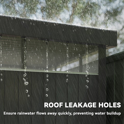 Black galvanised steel garden shed roof with drainage holes and rainwater dripping from the edge near roof windows