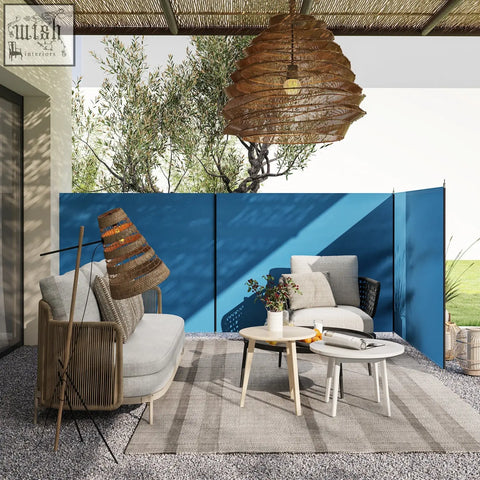 Woven rattan pendant light with warm amber glow shown near outsunny blue camping windbreak with steel poles carry bag and guy ropes