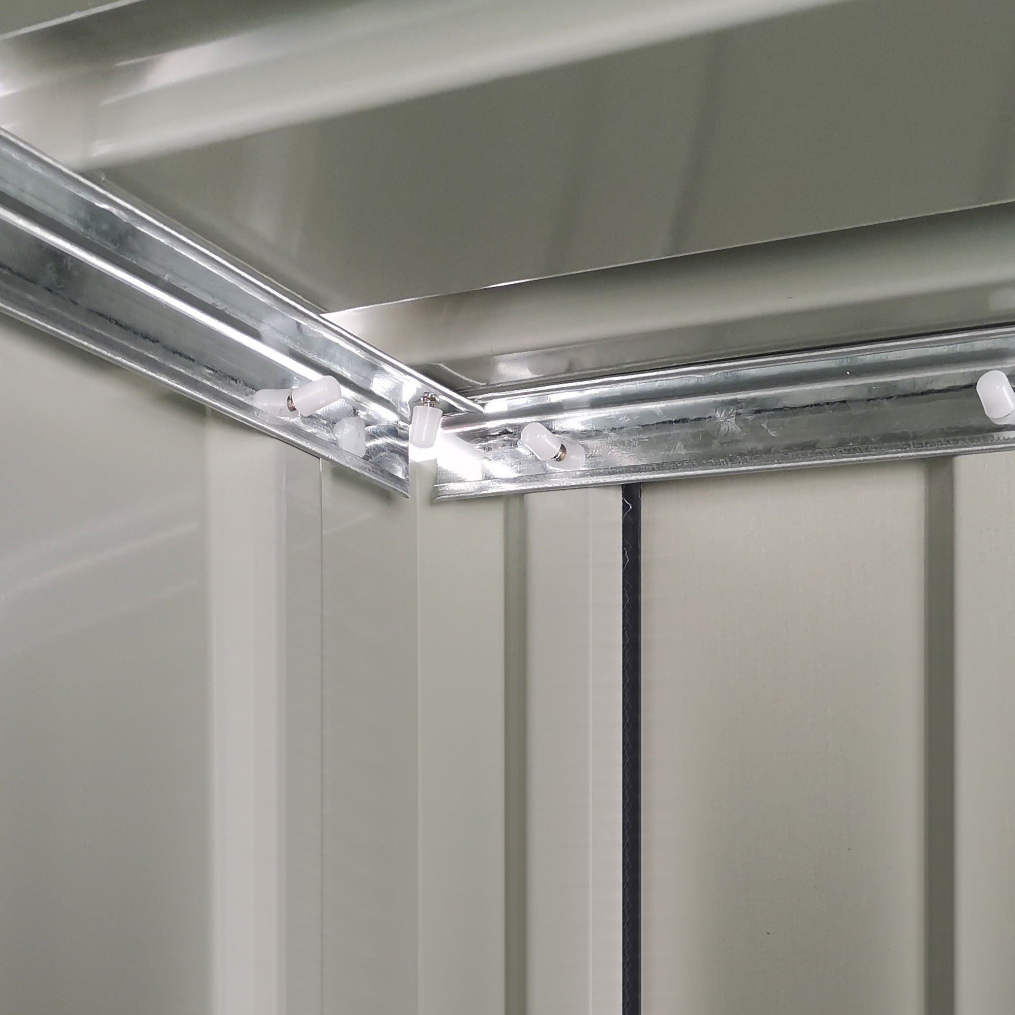 Silver metallic track with white plastic connectors for outsunny garden storage shed with sloped roof and foundation kit