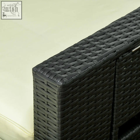 Black woven wicker outdoor storage cabinet with cream cushion near two reclining chairs and two storage footstools