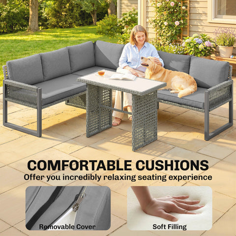 Gray woven wicker outdoor sectional furniture set with plush cushions and tempered glass dining table by Outsunny