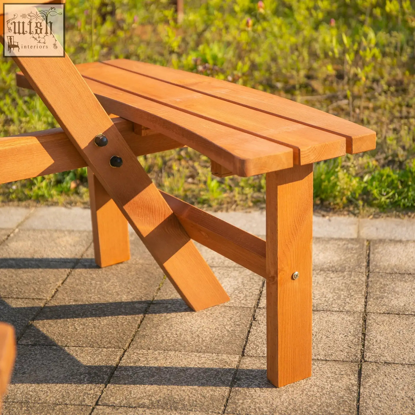 A light brown fir wood folding picnic table with slatted seating and sturdy wood construction for outdoor use