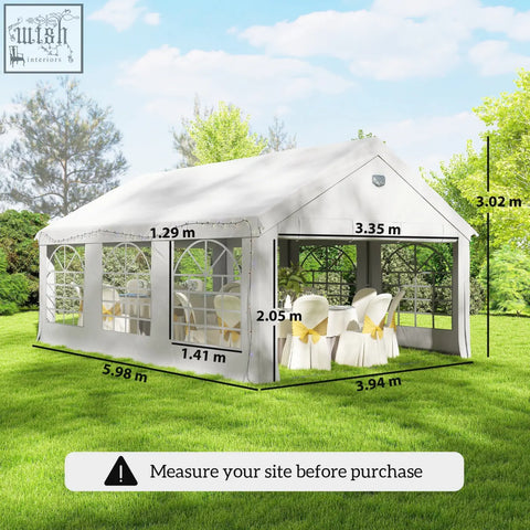 White fabric gazebo with arched windows and peaked roof featuring a galvanised steel frame for outdoor parties and weddings