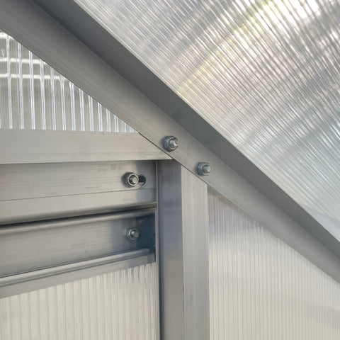 Silver aluminium alloy frame with ribbed translucent polycarbonate panels on outsunny lean to garden greenhouse
