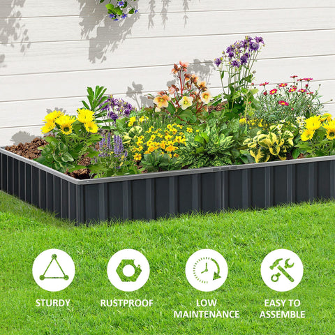 Black metal planter box with vertical ridged sides by Outsunny filled with colorful flowers to start growing a garden bed