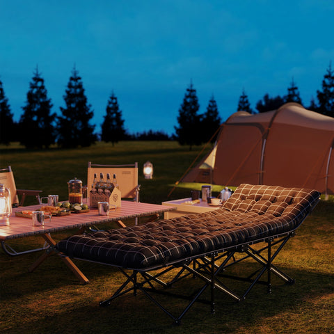 Black and white checkered cushioned camping cot with oxford fabric, storage pocket, and carry bag for easy folding