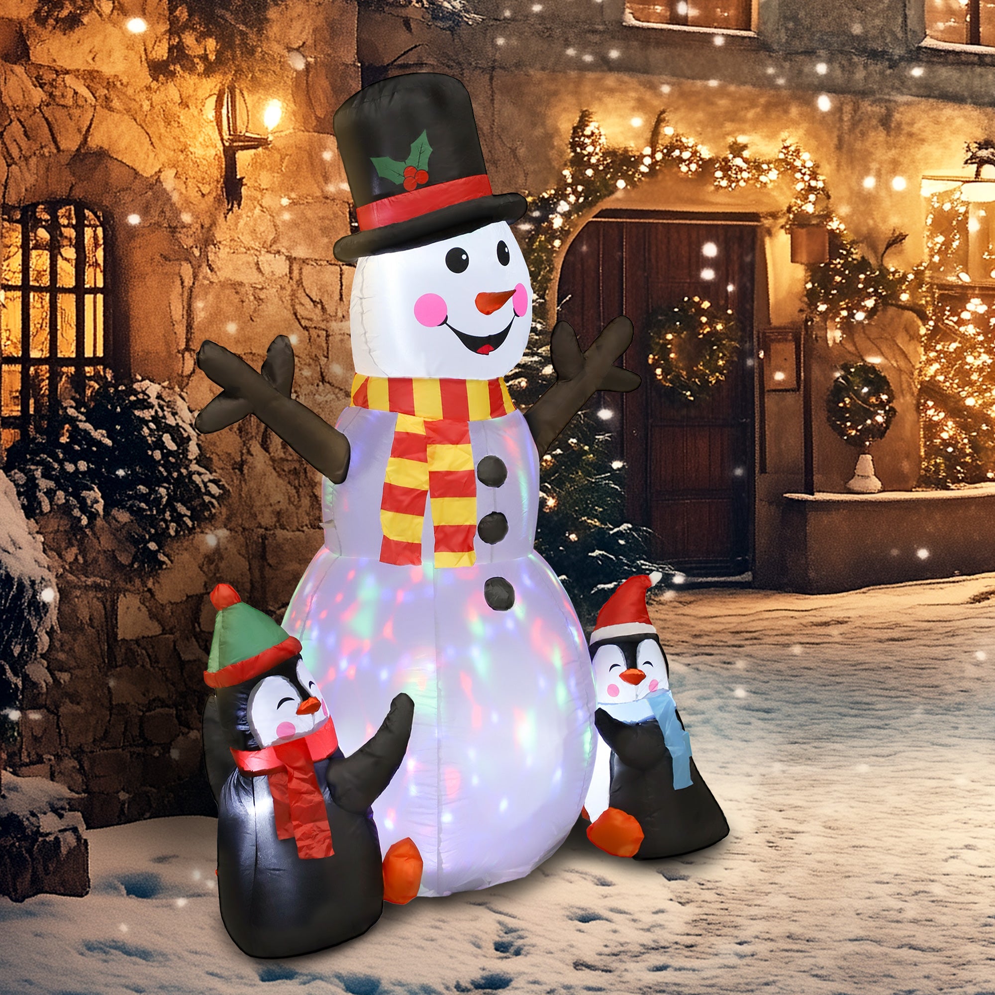Inflatable snowman with red yellow scarf and led lights surrounded by penguins with ground stakes for outdoor decor