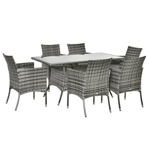 Gray woven wicker dining set with glass top table and six cushioned chairs perfect for garden furniture use