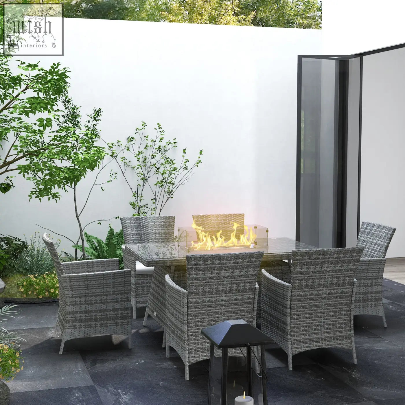 Gray woven wicker garden furniture six armchairs with a central propane fire pit table for outdoor dining