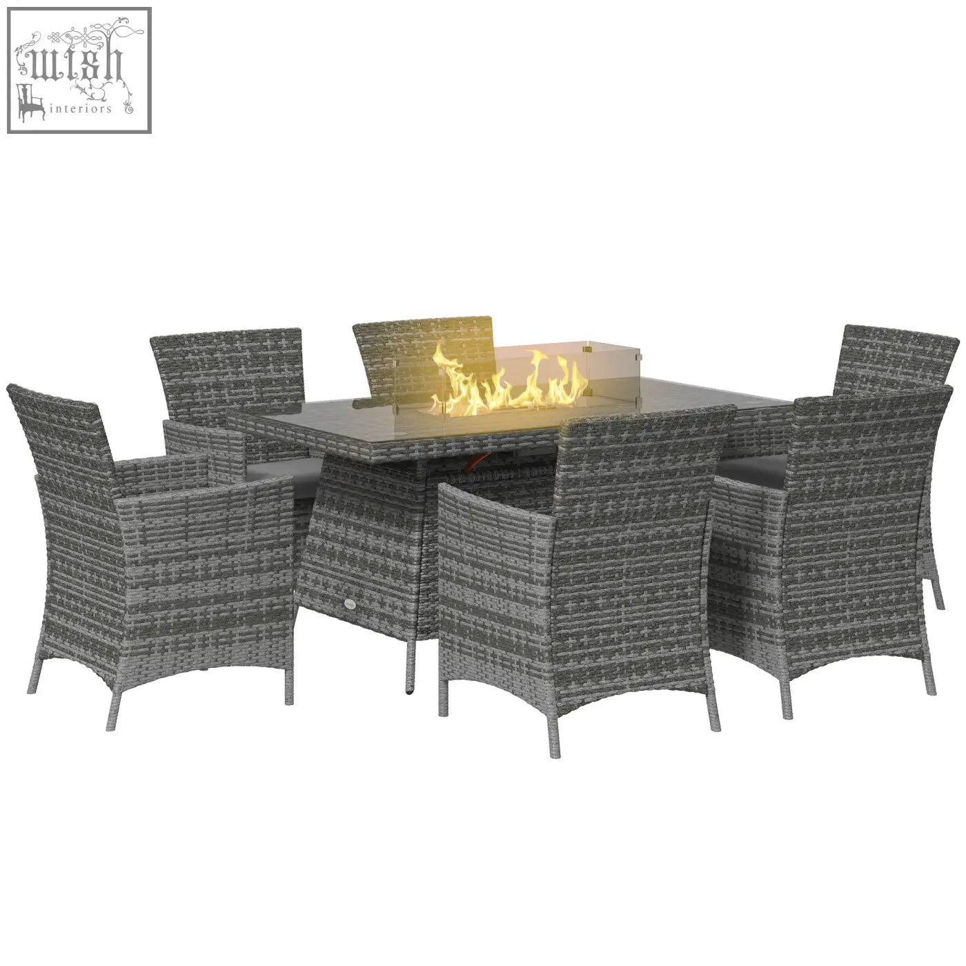 Gray wicker garden furniture set with glass-top propane fire pit table and six armchairs with cushions outdoors