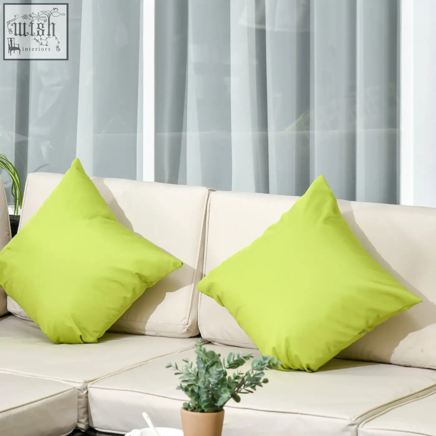 Two bright lime green square throw pillows on beige cushions of a brown outsunny 7-seater steel frame corner sofa set