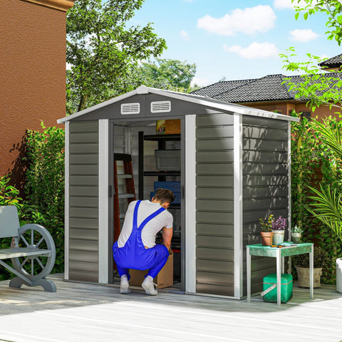 Gray plastic garden storage shed with white trim and ventilation vents featuring a galvanised steel frame