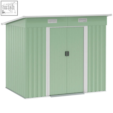 Light green corrugated metal storage shed with white trim and double doors, ideal for backyard with foundation kit option