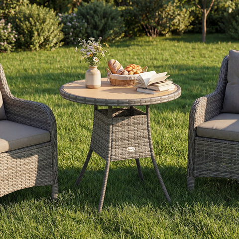 Gray wicker rattan dining table with round natural wood top and storage basket by Outsunny for outdoor use