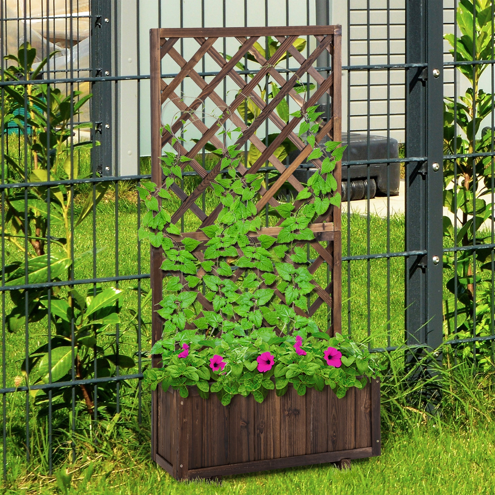 Dark brown fir wood flower box with integrated net board trellis filled with green foliage and pink petunias