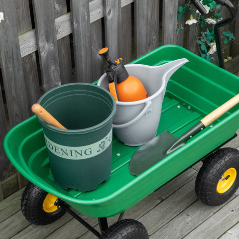 Green outsunny garden cart with black wheels yellow rims carrying gardening bucket watering can and tools for heavy duty use