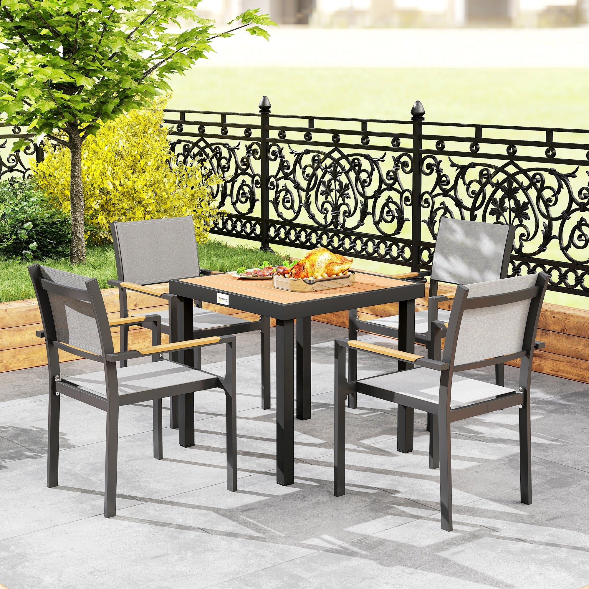 Outsunny black metal garden dining table with wooden top and four gray fabric outdoor dining chairs seating four people