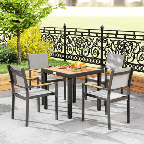 Outsunny black metal garden dining table with wooden top and four gray fabric outdoor dining chairs seating four people