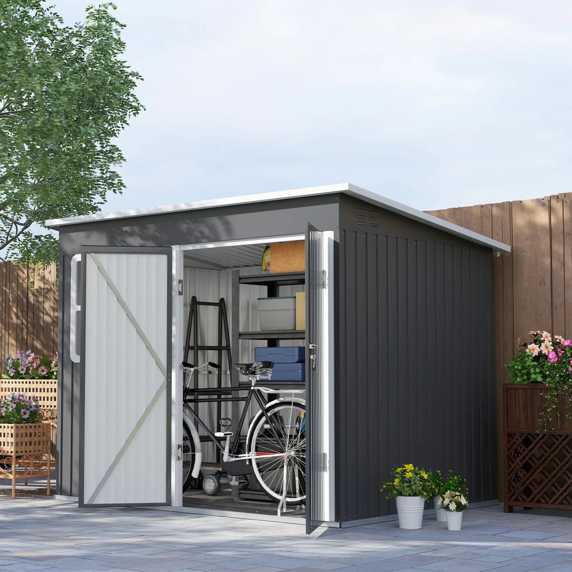 Dark gray galvanised steel outdoor storage shed with white trim, foundation kit, cross-braced door, and bike inside