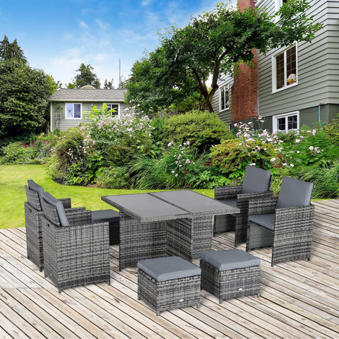 Gray wicker outdoor 8-seater rattan dining set with dark gray cushions and matching table for garden use