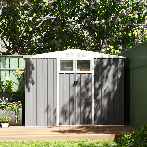 Gray metal garden shed with white trim window above double doors made of galvanised steel for outdoor storage