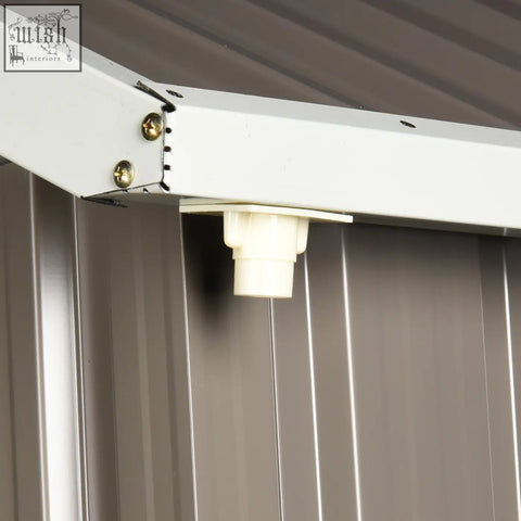 White plastic drain spout attached to grey galvanised metal garden shed frame with two doors and air vents