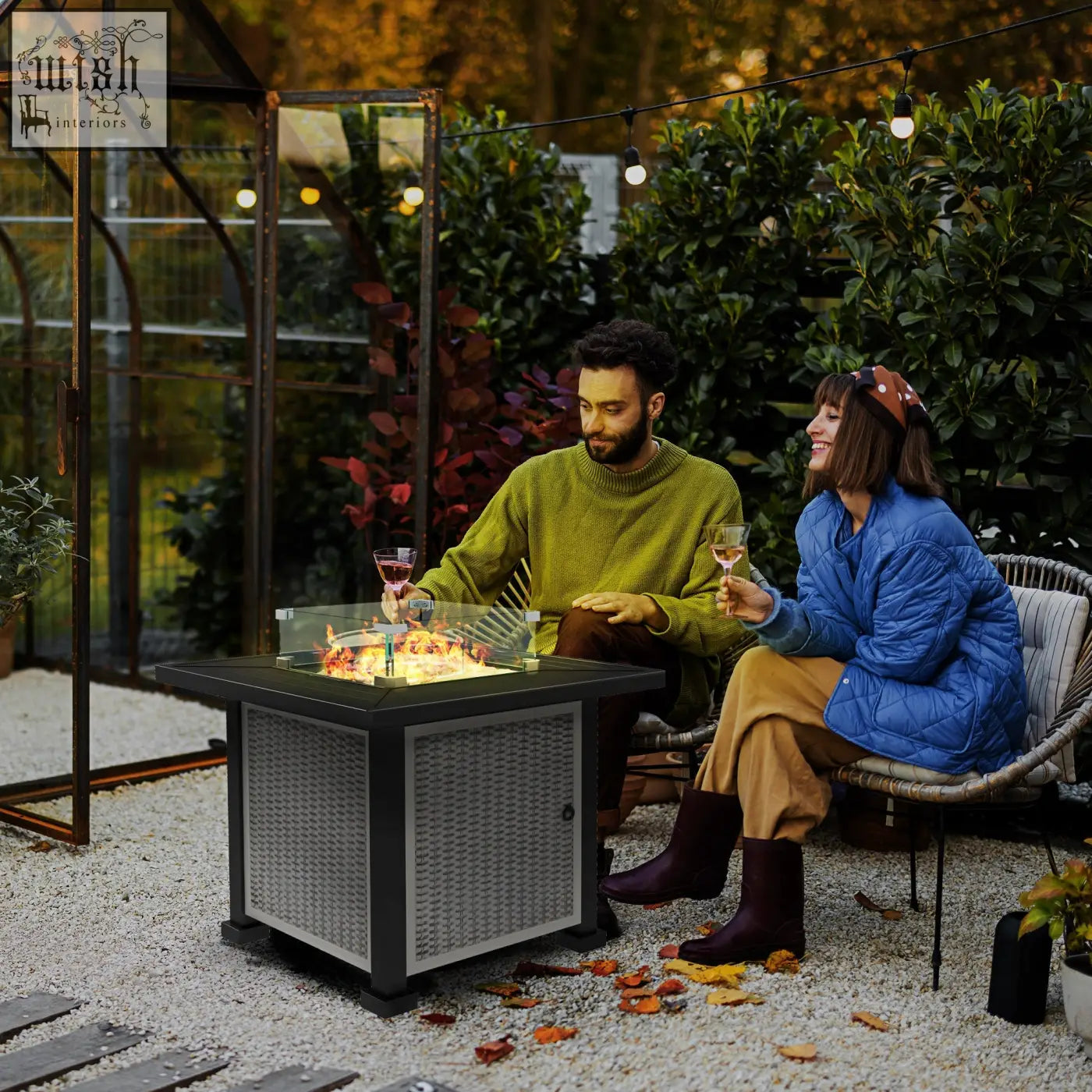 Black and gray wicker propane tank fire pit table with glass top and 50000 btu burner for outdoor use