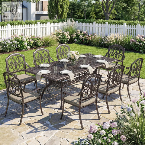 Brown cast aluminium garden dining set with ornate scrollwork beige cushions and parasol hole for patio use
