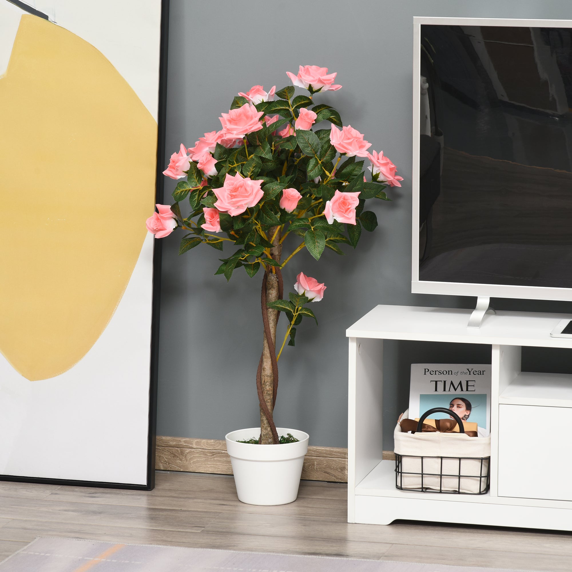 A pink outsunny artificial tree with lush green leaves planted in white ceramic pot with cement soil for decor