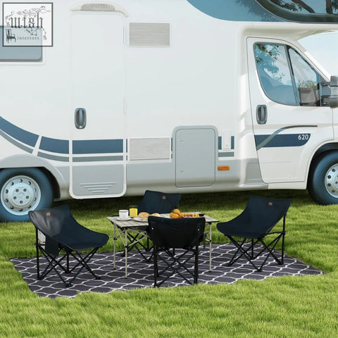 Outsunny black camping chairs with steel frame and fabric seat arranged around a table on a patterned rug