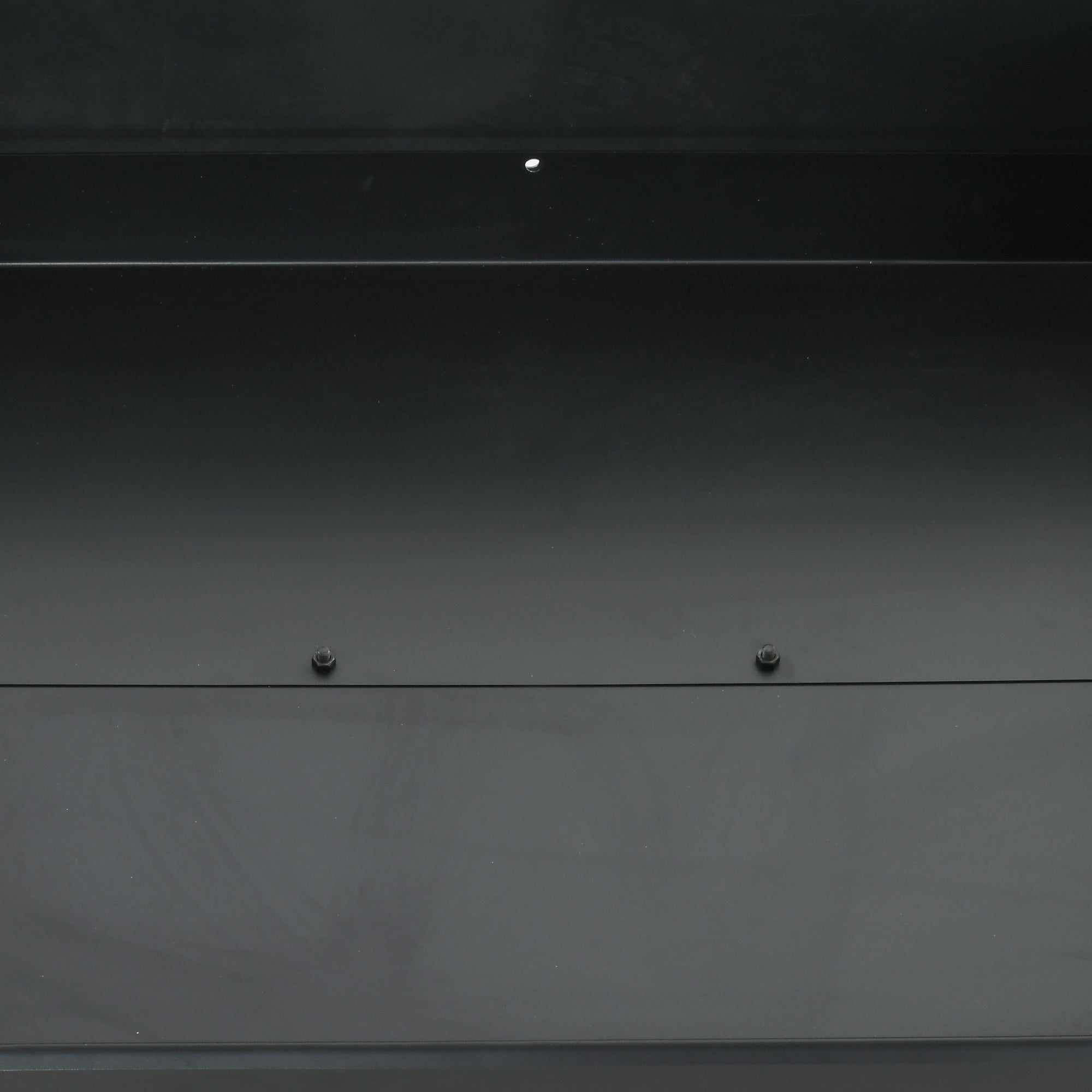 Dark gray metallic panel with two screws on outsunny charcoal bbq grill featuring two separate adjustable grill height