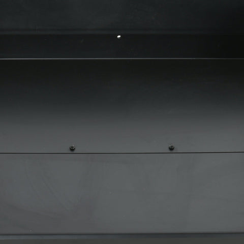 Dark gray metallic panel with two screws on outsunny charcoal bbq grill featuring two separate adjustable grill height