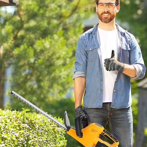 Yellow and black cordless hedge trimmer with 51cm serrated blade brushless motor and 2 batteries for shrubs and branches