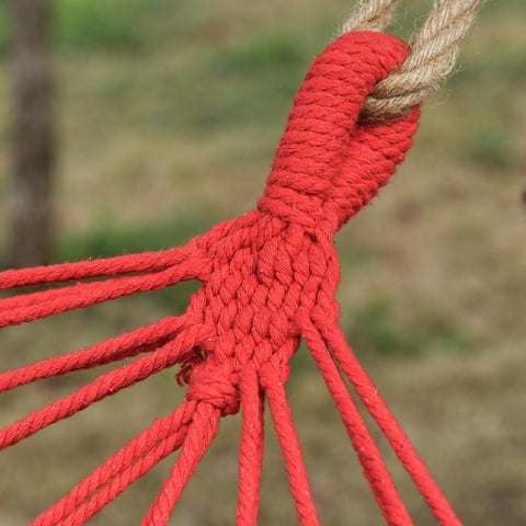 Red macrame rope knot tied to natural jute cord on outsunny cotton hammock soft portable swing chair with headrest and side pocket