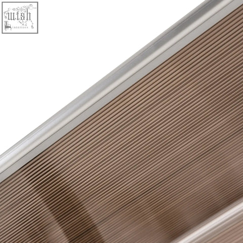 Brown outsunny door canopy with rigid plastic panel and metallic silver trim for outdoor use and uv resistance