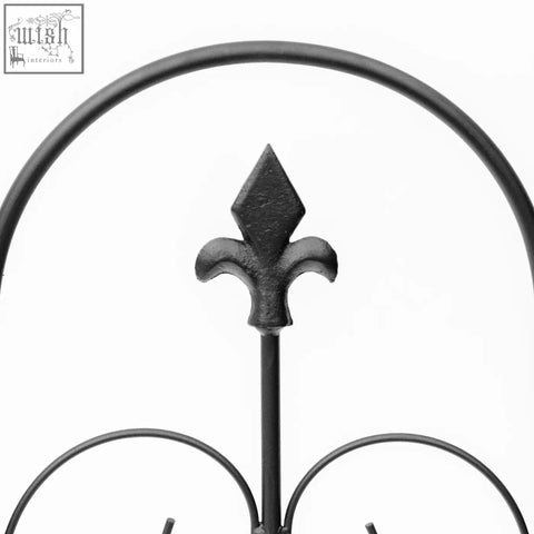 Black wrought iron fleur-de-lis finial on outsunny garden fence with rustproof scrollwork for patio decoration