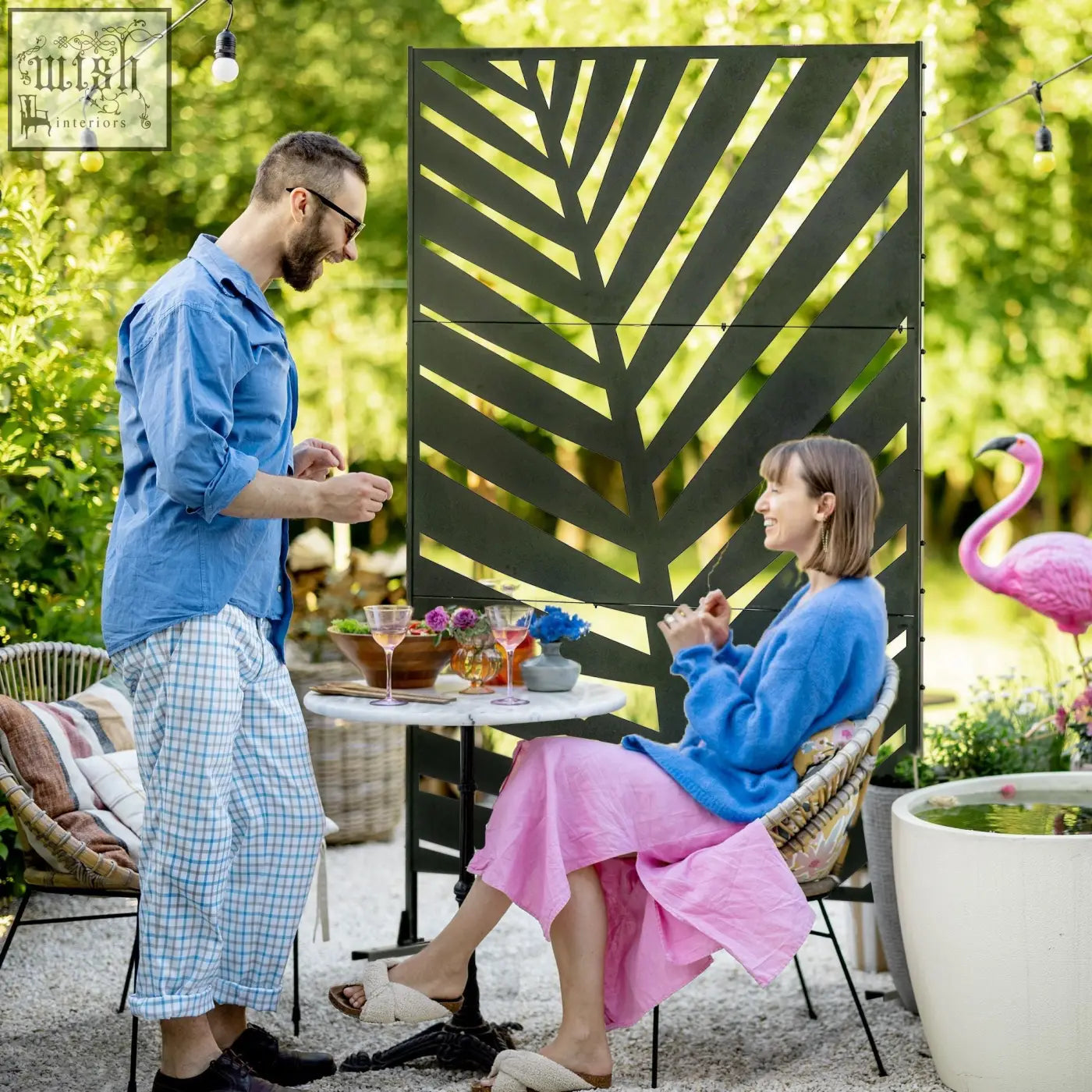 Black metal privacy screen with banana leaf pattern and expansion screws freestanding for garden patio use