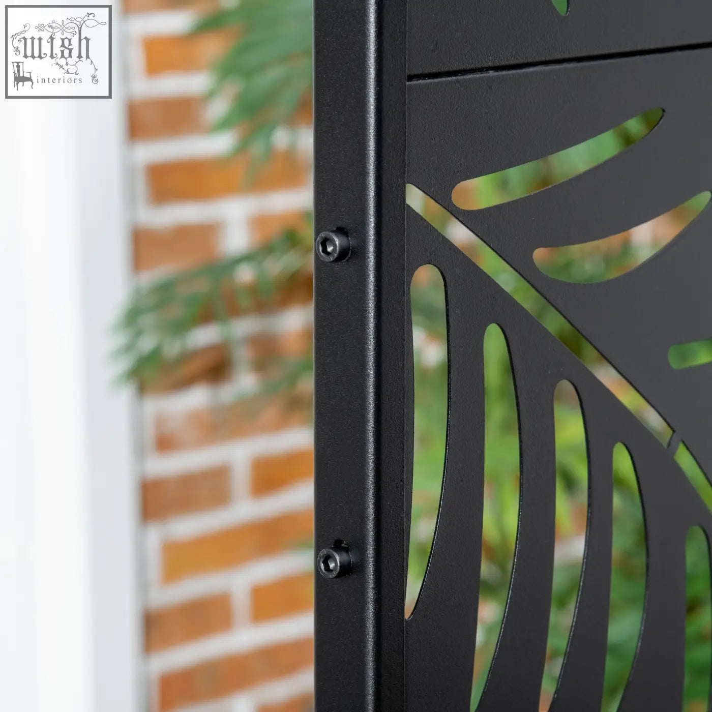 Outsunny black metal privacy screen with willow branch cut-out design and expansion screws for garden patio use