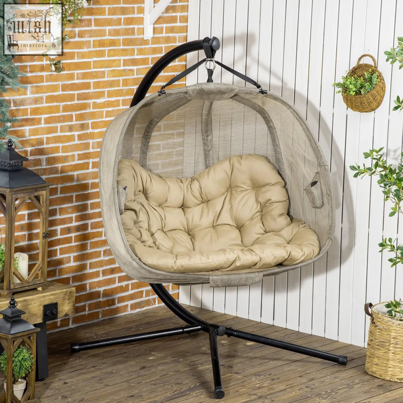 Beige mesh hanging egg chair with plush cushion and black metal frame seat basket for indoor and outdoor use