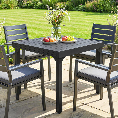 Dark gray aluminium extending garden table with slatted top and cushioned armchairs 80w x 75h outdoors