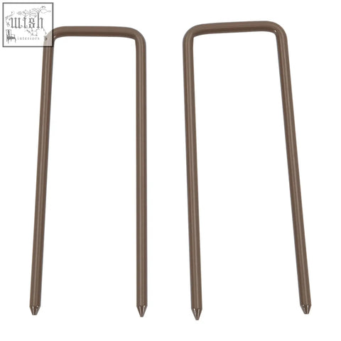 Two dark brown outsunny expanding metal garden markers with pointed tips as a climbing aid for gardens