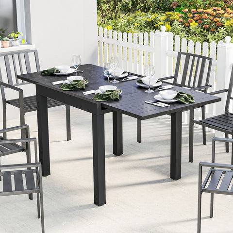 Black outsunny extendable garden table with faux wood top and sturdy metal legs for outdoor dining