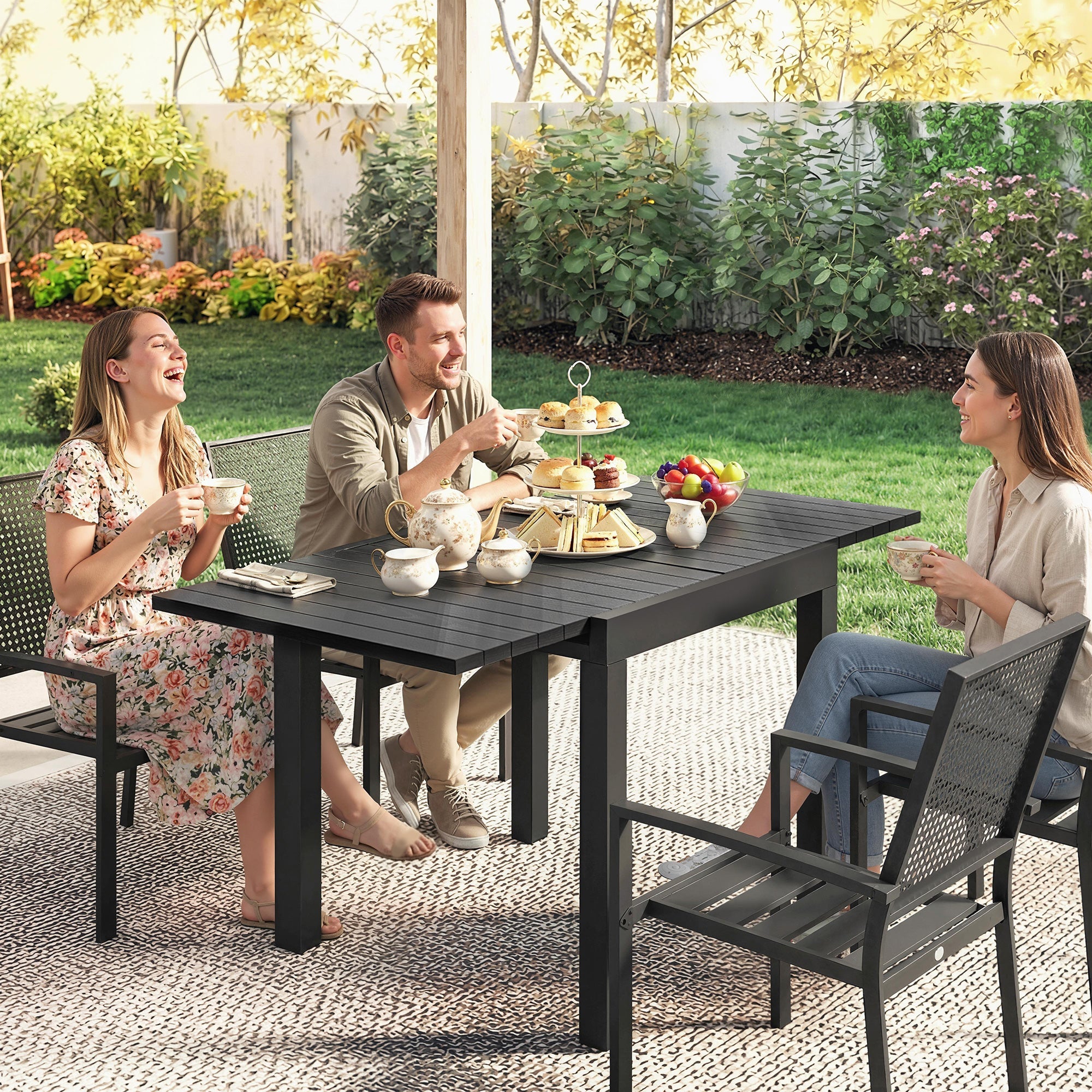 Black aluminium extendable garden table with faux wood slatted top and sturdy legs for outdoor dining