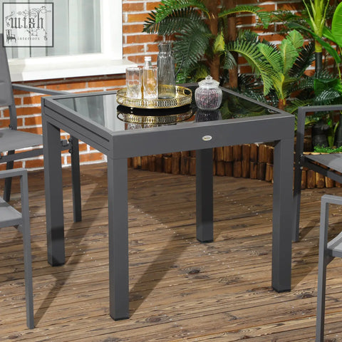 Gray metal outdoor dining table with tempered glass top and black aluminium frame by outsunny