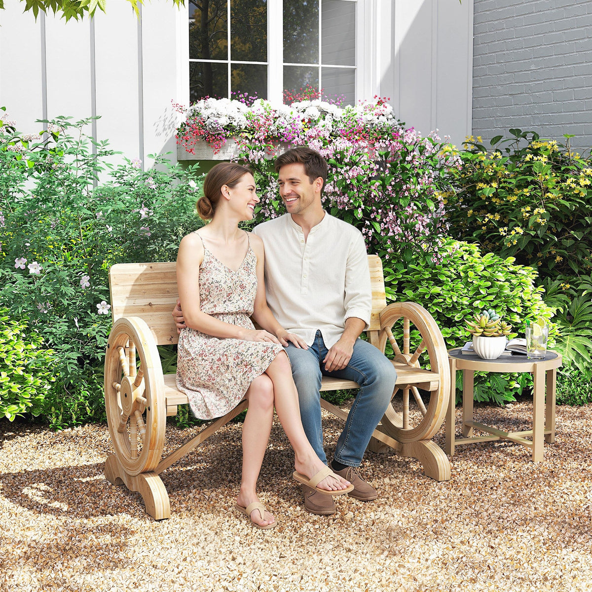 A rustic outsunny fir wood 2-seater wagon wheel bench with natural wood finish for outdoor garden use