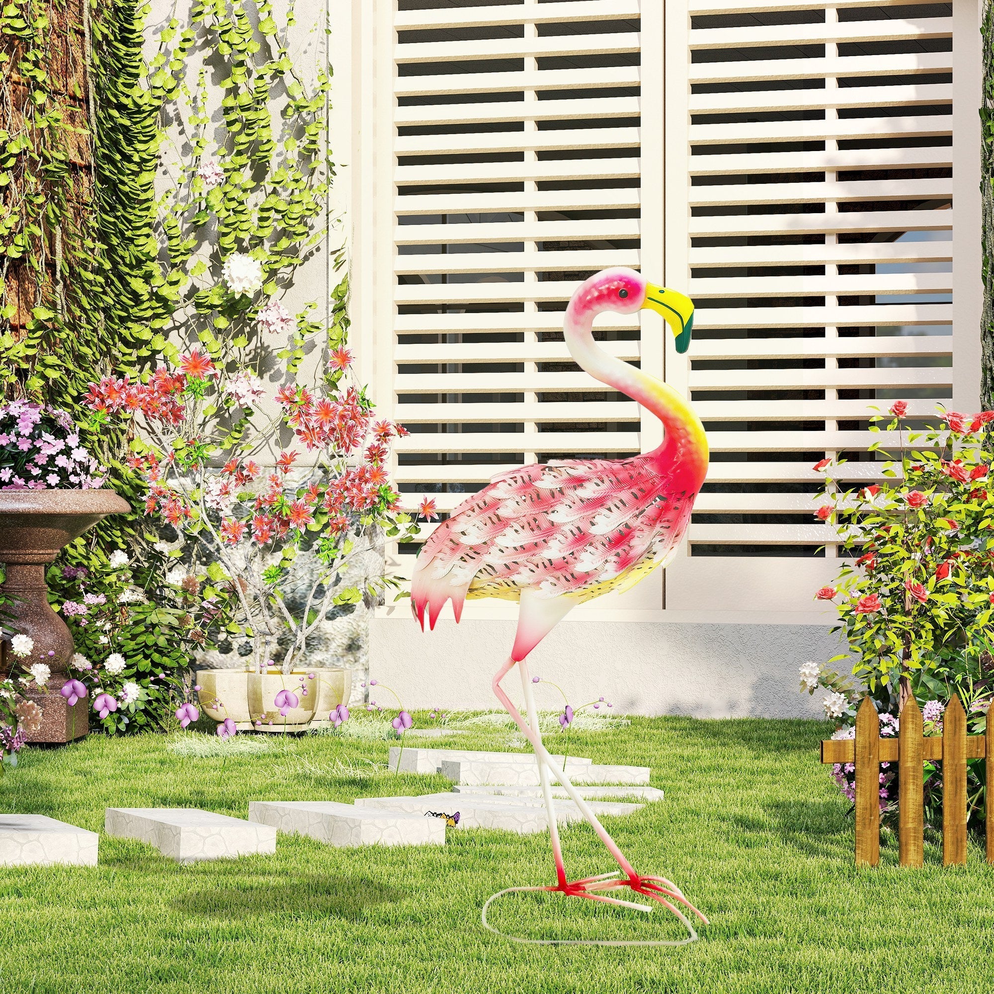 Vibrant pink and yellow metal outsunny flamingo garden statue with patterned body and u-shaped ground stakes on grass