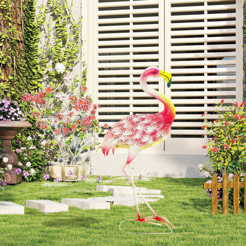 Vibrant pink and yellow metal outsunny flamingo garden statue with patterned body and u-shaped ground stakes on grass