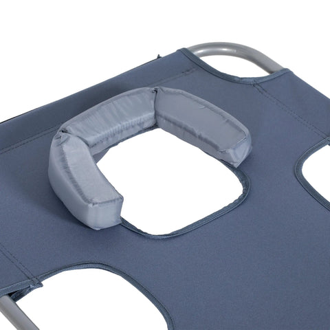 Gray padded neck support on foldable sun lounger with powder coated steel frame for beach and patio use