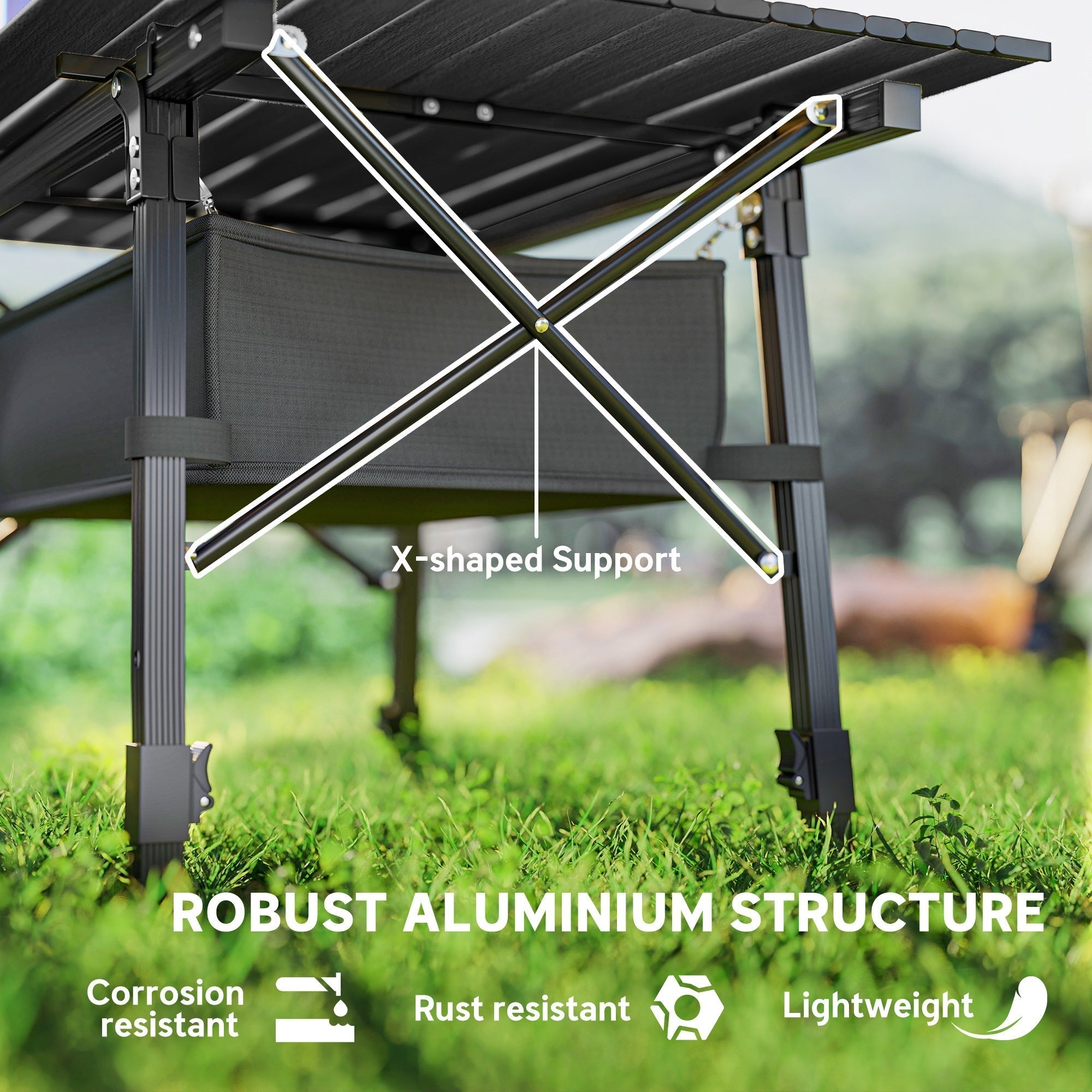 Black foldable camping table with x-shaped aluminum frame and oxford cloth storage basket for outdoor use